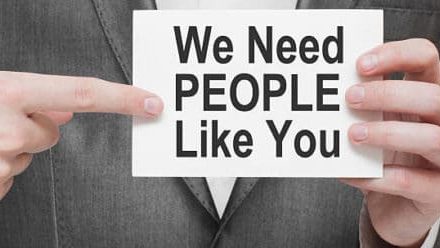 We Need People Like You. Card in businessman hands